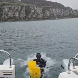 Diver rolling of a boat