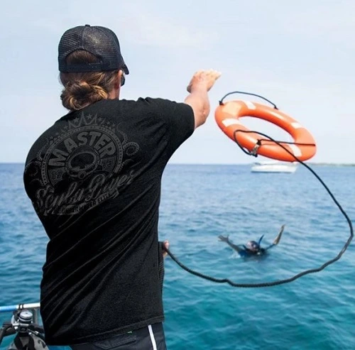 PADI Rescue diver throwing a Buoy